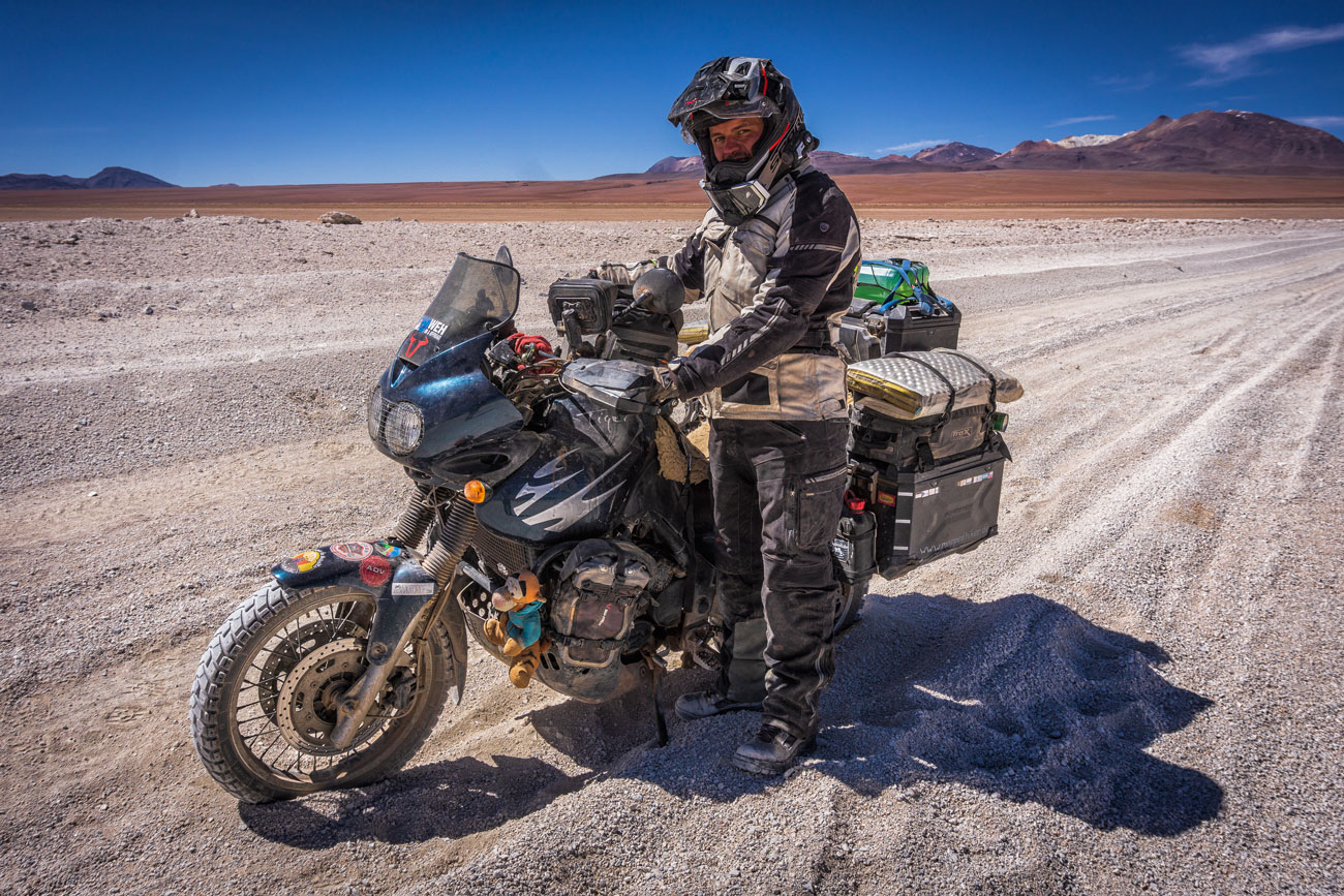 Moe with the motorcycle in the sand